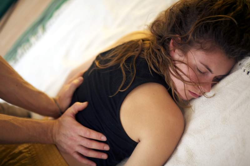 Demonstration of Thai massage working on the belly