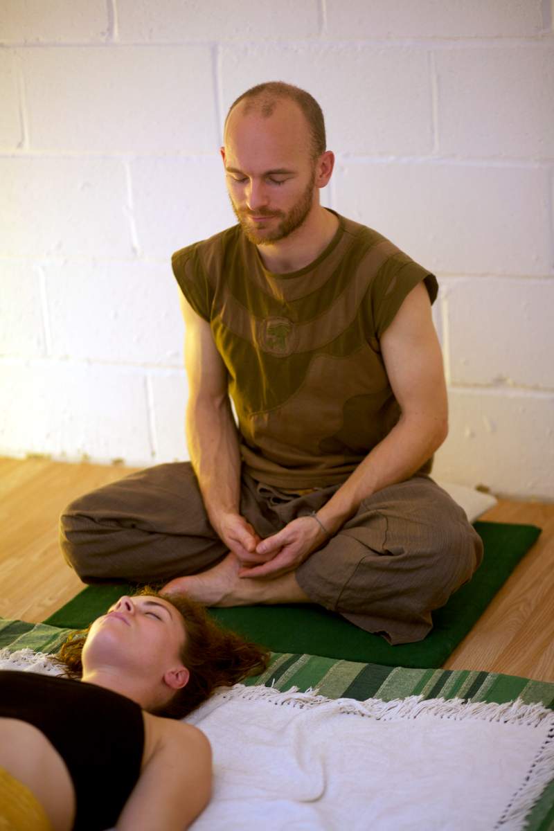 Demonstration of Thai massage working on the belly